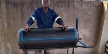 Matome Maphala with one of the braai stands he has designed