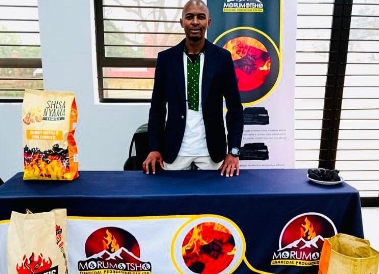 Atang Justice turns invasive wattle trees into charcoal and briquettes, creating jobs and promoting environmental restoration in Matatiele.