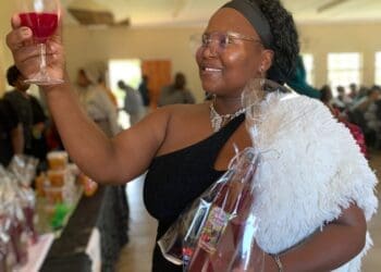 Abongile Kholeka Mdubeki (39), founder of Kholie Care from Mzingazi Agri-Village, showcases her handmade Kholie Beetroot Wine.