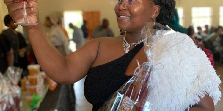 Abongile Kholeka Mdubeki (39), founder of Kholie Care from Mzingazi Agri-Village, showcases her handmade Kholie Beetroot Wine.